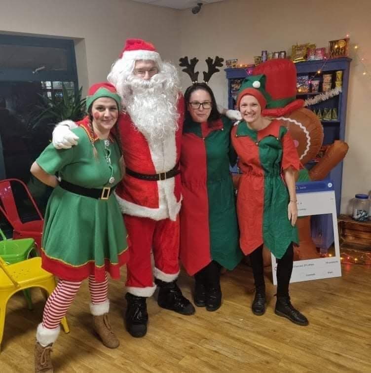 Santa and helpers at a Woodgate visit